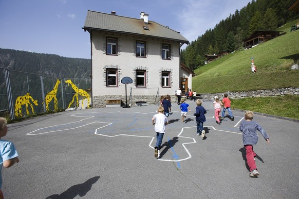 Pupils play soccer on the playground at the elementary school in Monstein near Davos in the canton of Grisons, Switzerland, pictured on September 11, 2008. The elementary school Davos Monstein is a co ...