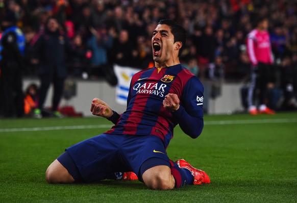 BARCELONA, SPAIN - MARCH 22: Luis Suarez of Barcelona celebrates as he scores their second goal during the La Liga match between FC Barcelona and Real Madrid CF at Camp Nou on March 22, 2015 in Barcel ...