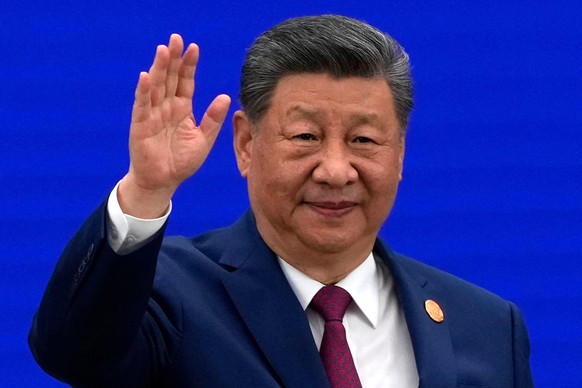 Chinese President Xi Jinping waves as he arrives at the opening ceremony for the World AI Conference in Shanghai, Friday, July 17, 2026. (AP Photo/Ng Han Guan, Pool)
Xi Jinping
