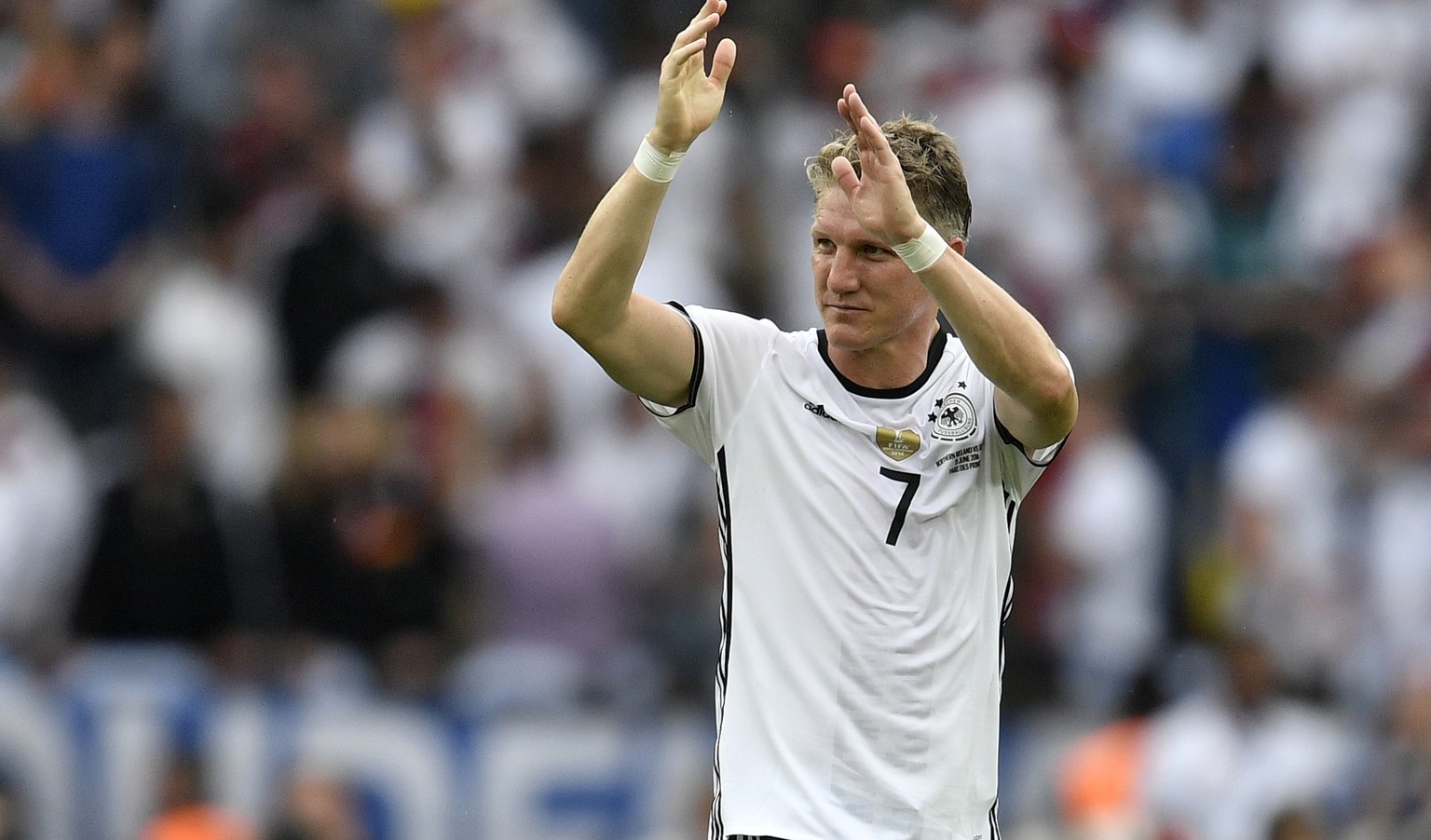 Germany's Bastian Schweinsteiger gestures at the end of the Euro 2016 Group C soccer match between Northern Ireland and Germany at the Parc des Princes stadium in Paris, France, Tuesday, June 21, 2016 ...