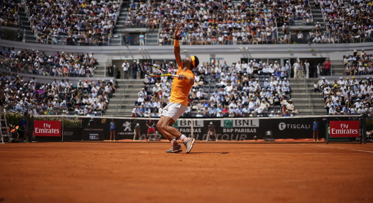 Spain's Rafael Nadal serves the ball to Italy's Fabio Fognini during a quarter final match at the Italian Open tennis tournament in Rome, Friday, May 18, 2018. Nadal won 4-6, 6-1, 6-2. (AP P ...