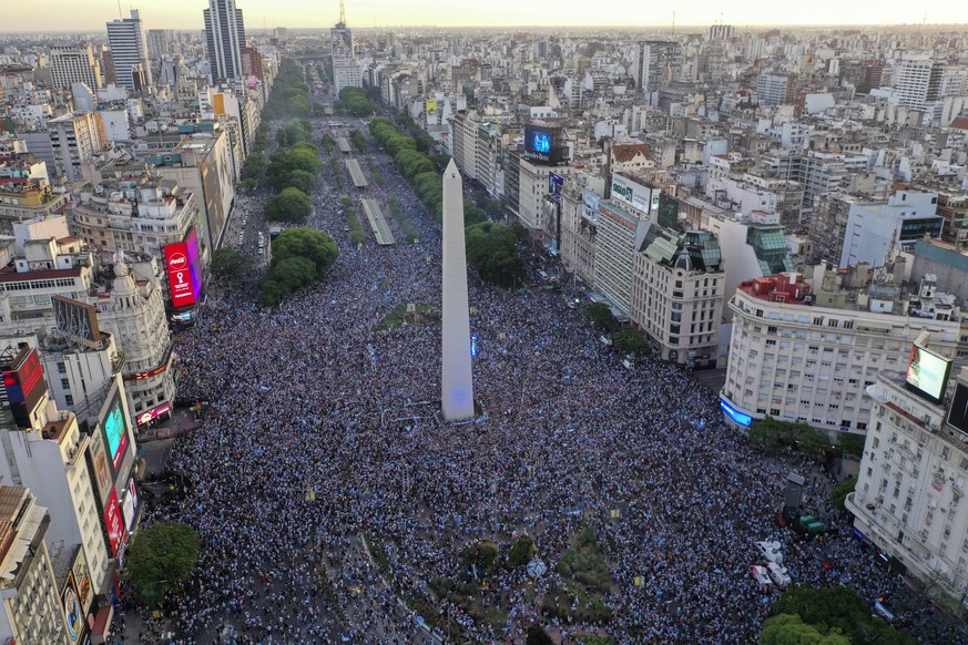 Argentina soccer fans celebrate their team&#039;s victory over Croatia after watching the team&#039;s World Cup semifinal match in Qatar on TV, in downtown Buenos Aires, Argentina, Tuesday, Dec. 13, 2 ...