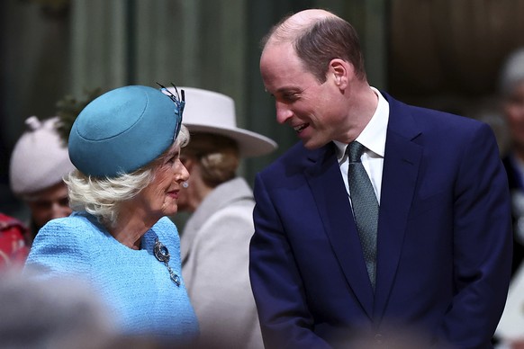 Britain's Queen Camilla, left, and Britain's Prince William speak as they attend the annual Commonwealth Day service ceremony at Westminster Abbey in London, Monday, March 11, 2024. (Henry N...