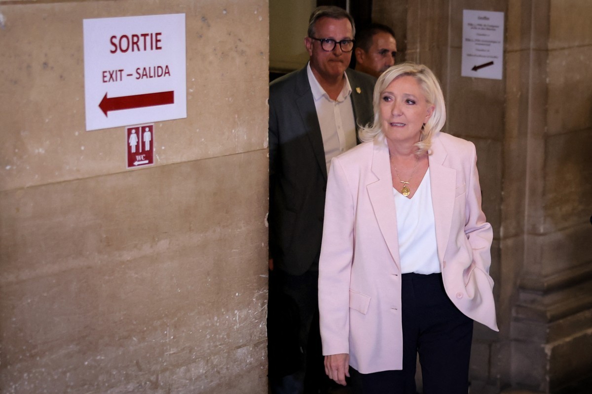 President of far-right party Rassemblement National (RN) parliamentary group Marine Le Pen arrives to attend the verdict in the appeal trial of RN former or actual members on charges of embezzlement o ...