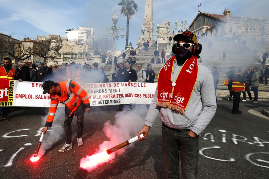 epa08197190 Members of the French labor union General Confederation of Labor (CGT) participate in a demonstration against pension reforms in Marseille, France, 06 February 2020. Unions representing ra ...