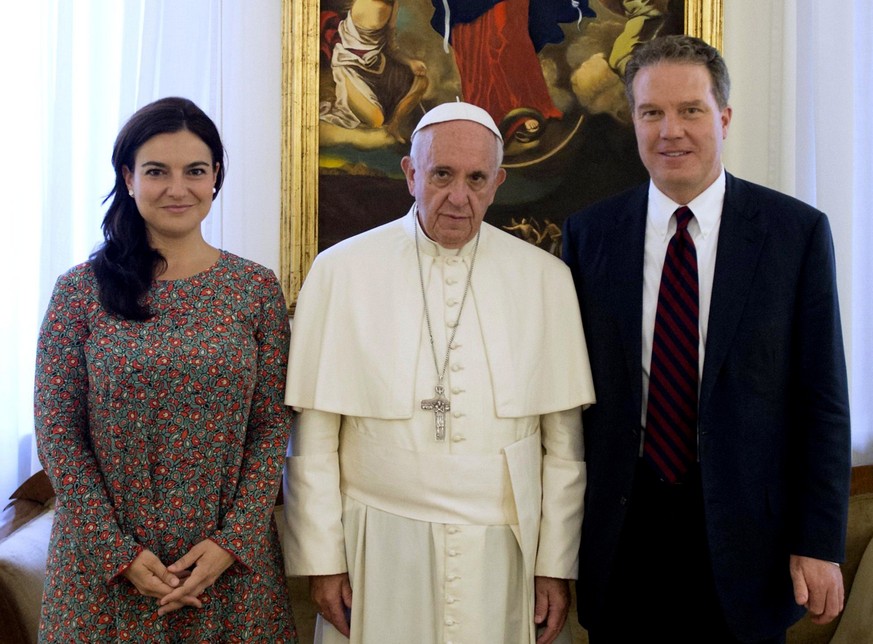 epa07255525 (FILE) - A handout photo made available by the L&#039;Osservatore Romano showing Pope Francis with Greg Burke and Paloma Garcia Ovejero at the Vatican, Monday, July 11, 2016, (reissued 31  ...