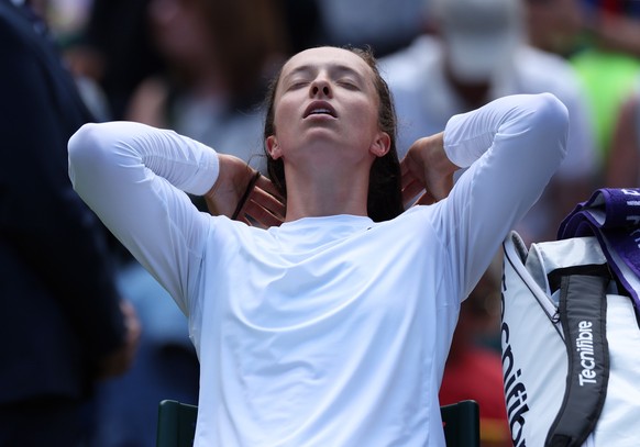 epa10727703 Iga Swiatek of Poland adjustst her hair prior her Women&#039;s Singles 2nd round match against Sara Sorribes Tormo of Spain at the Wimbledon Championships, Wimbledon, Britain, 05 July 2023 ...