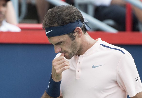 Roger Federer, of Switzerland, bites his nail as he faces David Ferrer, of Spain, in the Rogers Cup men&#039;s tennis tournament, Thursday, Aug. 10, 2017 in Montreal. (Paul Chiasson/The Canadian Press ...