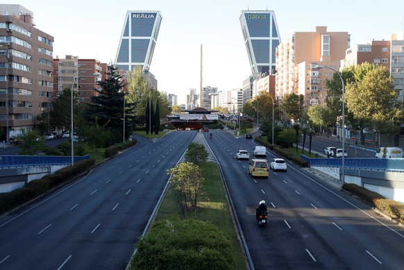 epa08723451 View of Castellana Avenue with very little traffic in downtown in Madrid, Spain, 06 October 2020. Madrid capital city and other 9 towns in the region have been &#039;closed&#039; by the ce ...