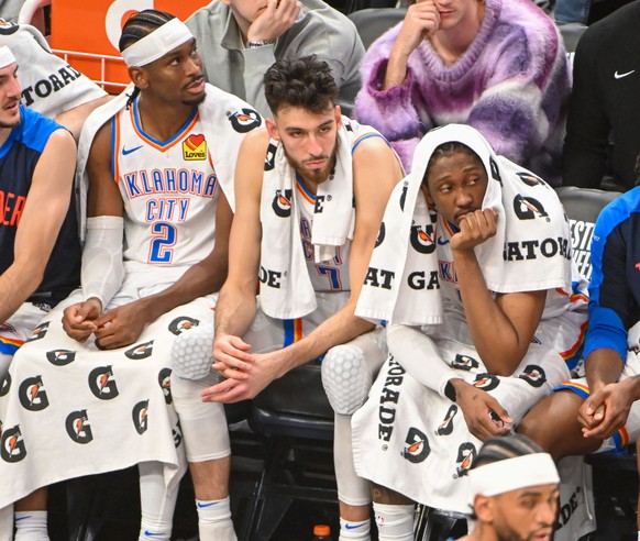 epa12133112 Oklahoma City Thunder guard Shai Gilgeous-Alexander (L), center Chet Holmgren (C) and forward Jalen Williams (R) react during the second half of game three of the NBA Western Conference fi ...