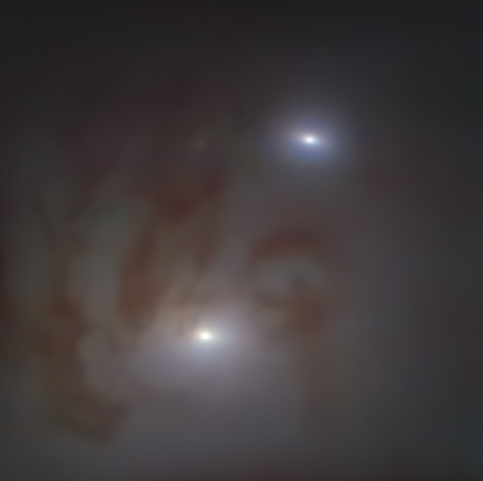 Nahaufnahme der beiden hellen galaktischen Kerne in NGC 7727, einer 89 Millionen Lichtjahre von der Erde entfernten Galaxie im Sternbild Wassermann, die jeweils ein supermassereiches schwarzes Loch be ...