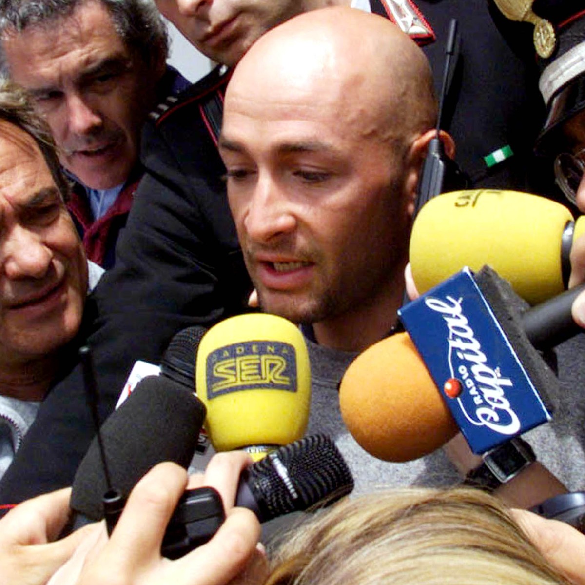 Italy's Marco Pantani answers media questions as he leaves his hotel in Madonna di Campiglio Saturday, June 5, 1999, after he was banned from the Tour of Italy cycling race after tests showed unu ...