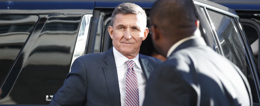 FILE - President Donald Trump&#039;s former National Security Advisor Michael Flynn arrives at federal court in Washington, Tuesday, Dec. 18, 2018. President Donald Trump has pardoned Michael Flynn, t ...