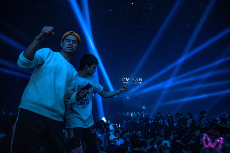 epa08913042 People dance at a night club at the New Year?s party in Wuhan, China, 01 January 2021. Life in Wuhan, a Chinese city of more than 11 million, which nearly a year ago became the epicenter o ...