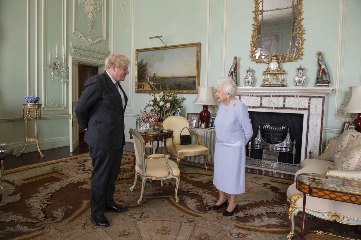 Britain's Queen Elizabeth II greets Prime Minister Boris Johnson at an audience at Buckingham Palace, London, Wednesday June 23, 2021, the Queen's first in-person weekly audience with the Pr ...
