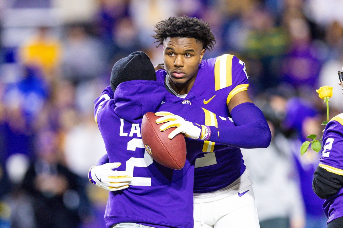 NCAA, College League, USA Football: Oklahoma at Louisiana State Nov 30, 2024 Baton Rouge, Louisiana, USA LSU Tigers wide receiver Kyren Lacy 2 hugs his family as seniors are being honored during the b ...