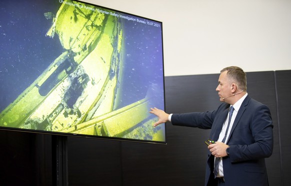 Rene Arikas, director of the Estonian Accident Investigation Board points as he speaks during a joint news conference with Jonas Backstrand, deputy Director of the Swedish Accident Investigation Board ...