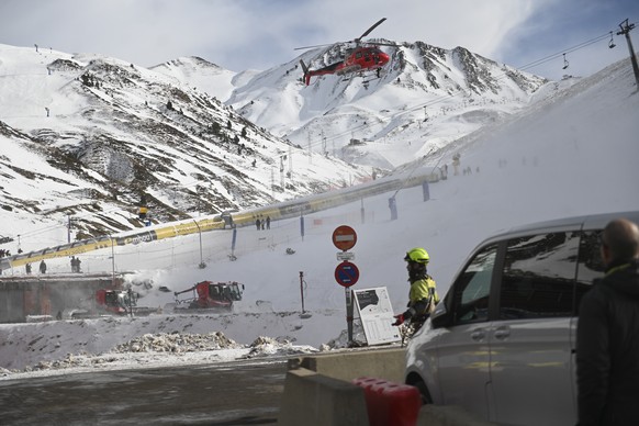 An emergency helicopter flies over the ski lifts at the Astum ski resort in Huesca, Spain, northern Spain on Saturday, Jan 18, 2025, where several people have been injured. (Ver�nica Lacasa/Europa Pre ...