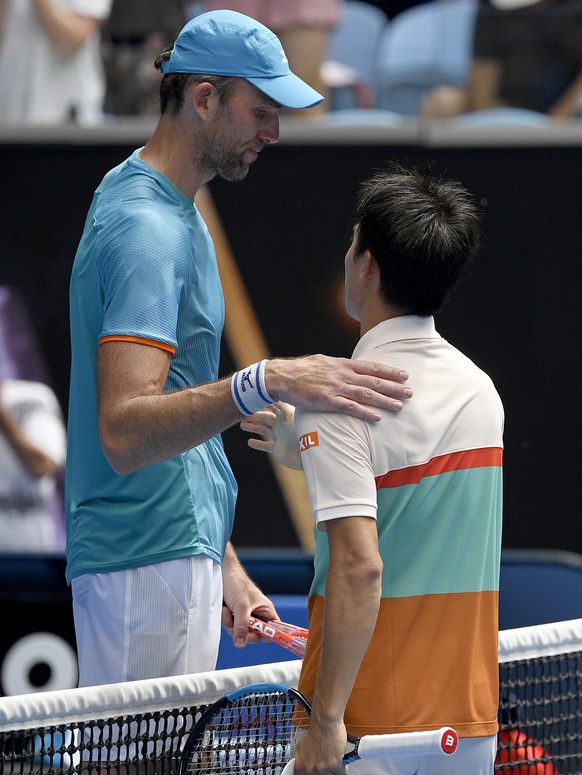 Japan&#039;s Kei Nishikori, right, is congratulated by Croatia&#039;s Ivo Karlovic, left, after winning their second round match at the Australian Open tennis championships in Melbourne, Australia, Th ...