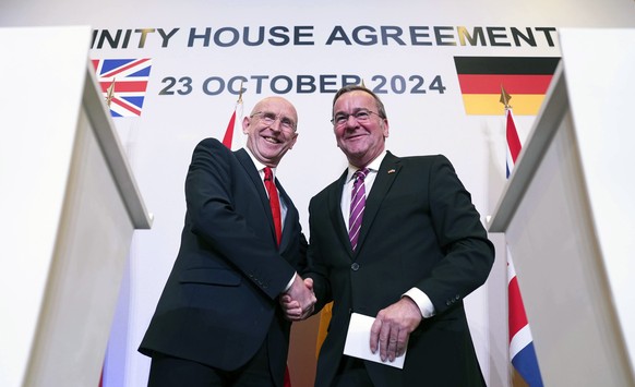 British Defence Secretary John Healey, left, and his German counterpart Boris Pistorius shake hands at a press conference after signing a new UK-Germany Defence Agreement at Trinity House in London, W ...