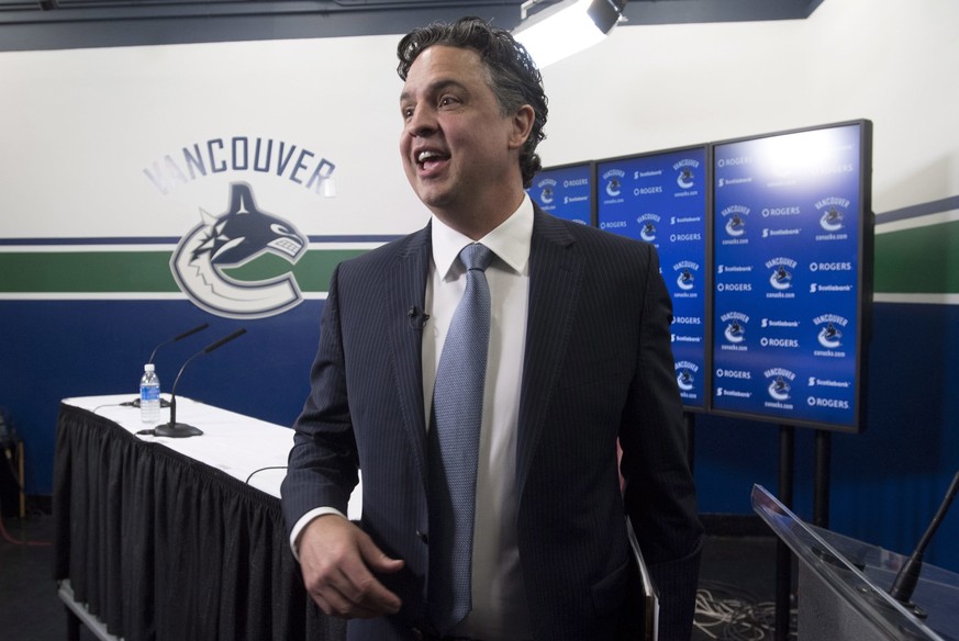 Vancouver Canucks new head coach Travis Green walks off following a news conference in Vancouver, British Columbia, Wednesday, April, 26, 2017. (Jonathan Hayward/The Canadian Press via AP)