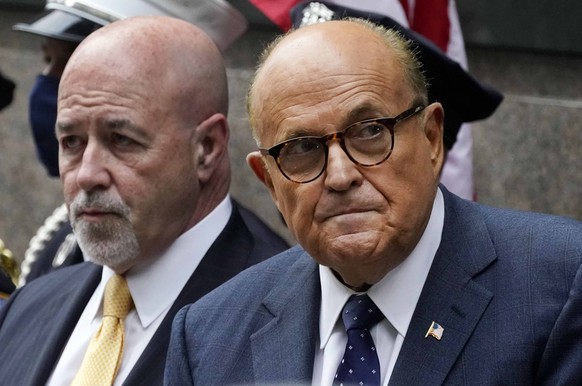 FILE - This photo from Friday Sept. 11, 2020, shows former New York Mayor Rudolph Giuliani, right, and former New York City police Commissioner Bernard Kerik, left, during the Tunnel to Towers ceremon ...