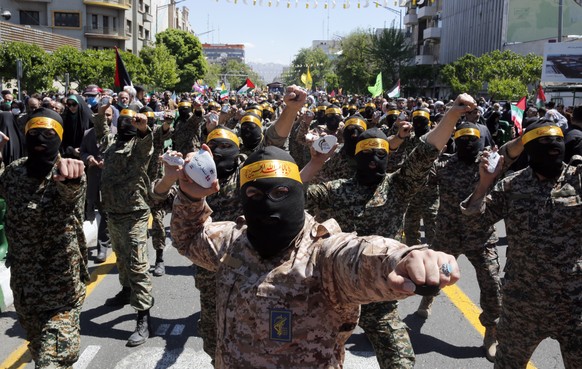 epa10572146 Members of the Basij paramilitary forces take part in a rally marking Al Quds Day in Tehran, Iran, 14 April 2023. Al-Quds Day was declared in 1979 by the late Ayatollah Khomeini, founder o ...