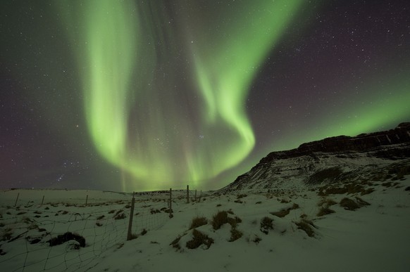 File-In this March 1, 2017, file photo the Northern Lights, or aurora borealis, appear in the sky over Bifrost, Western Iceland. The Northern Lights are created as a result of collisions between gaseo ...