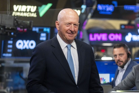 epa12241429 David M. Solomon, CEO of investment banking firm Goldman Sachs, speaks during a television interview on the floor of the New York Stock Exchange, in New York, New York, USA, 16 July 2025.  ...