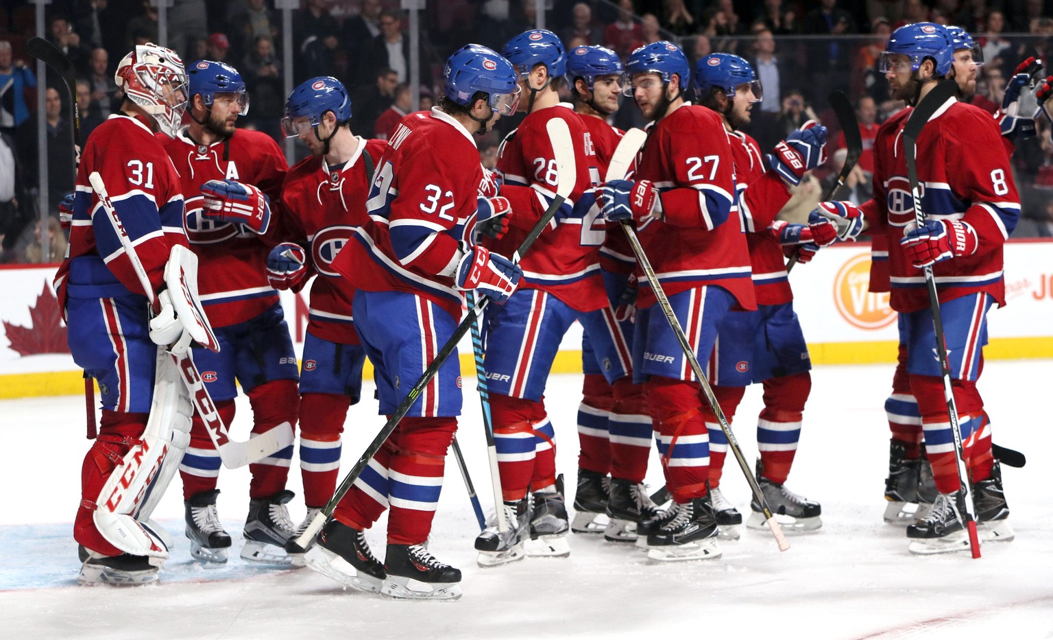 Oct 24, 2016; Montreal, Quebec, CAN; Montreal Canadiens players celebrate their win against Philadelphia Flyers after the third period at Bell Centre. Mandatory Credit: Jean-Yves Ahern-USA TODAY Sport ...