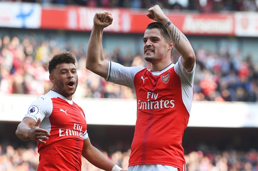 epa05948781 Arsenal&#039;s Granit Xhaxa (R) celebrates after scoring the 1-0 lead during the English Premier League soccer match between Arsenal FC and Manchester United in London, Britain, 07 May 201 ...