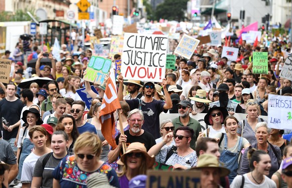 epa07438342 School students take part in a climate change strike in Brisbane, Australia, 15 March 2019. Hundreds of thousands of students are expected to strike worldwide demanding urgent political ac ...