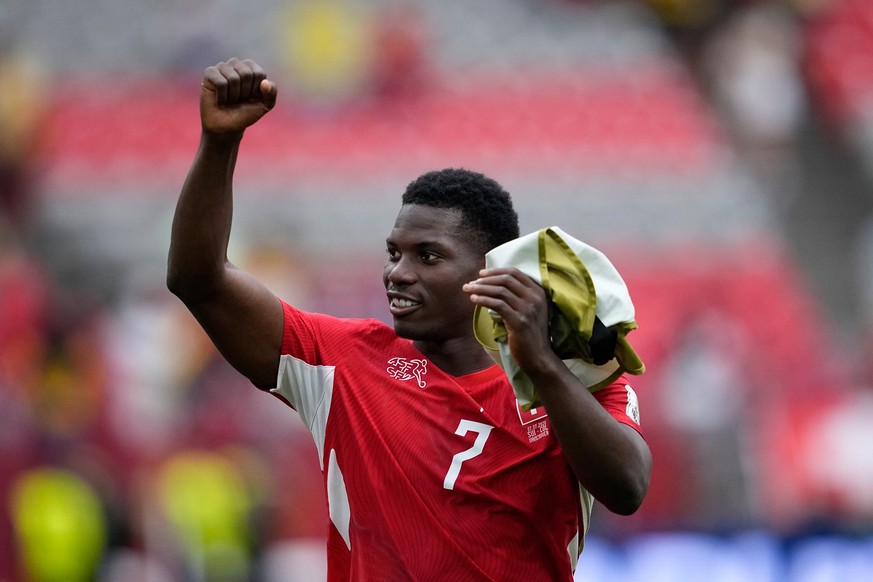Switzerland's Breel Embolo reacts after Switzerland won a penalty shootout in the World Cup round of 16 soccer match between Switzerland and Colombia in Vancouver, British Columbia, Tuesday, July ...