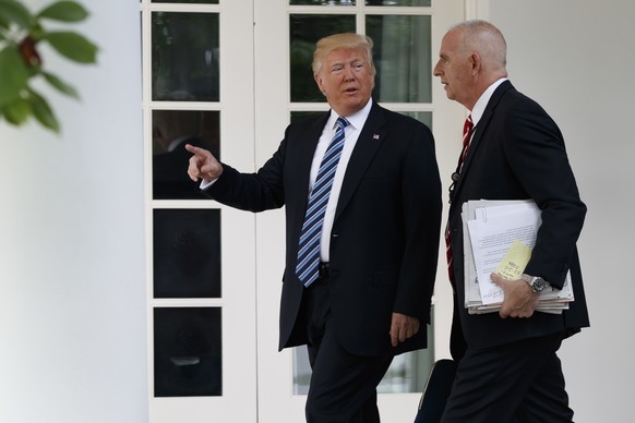 President Donald Trump walks with aide Keith Schiller to the Oval Office of the White House in Washington, Tuesday, May 2, 2017. President Donald Trump says the nation &quot;needs a good `shutdown&#03 ...