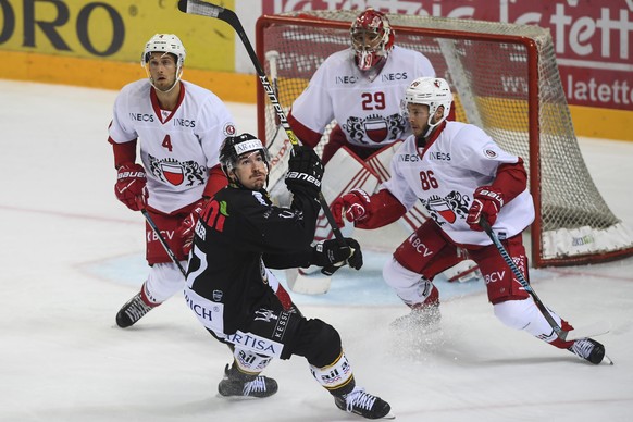 Laisanne&#039;s player Petteri Lindbohm, Lugano&#039;s player Dario Buergler, Lausanne&#039;s goalkeeper Luca Boltshauser and Lausanne&#039;s player Dario Trutmann in action, from left, during the reg ...