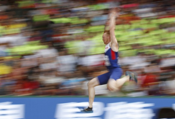 Greg Rutherford of Britain competes in the men&#039;s long jump qualifying round during the 15th IAAF World Championships at the National Stadium in Beijing, China, August 24, 2015. REUTERS/Phil Noble