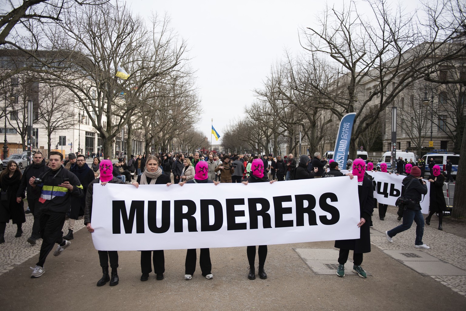 In this photo provided by protest group Pussy Riot on Sunday, February 18, 2024, members hold up a sign in front of the Russian Embassy in connection with the death of Russian opposition leader Alexei Navalny,…