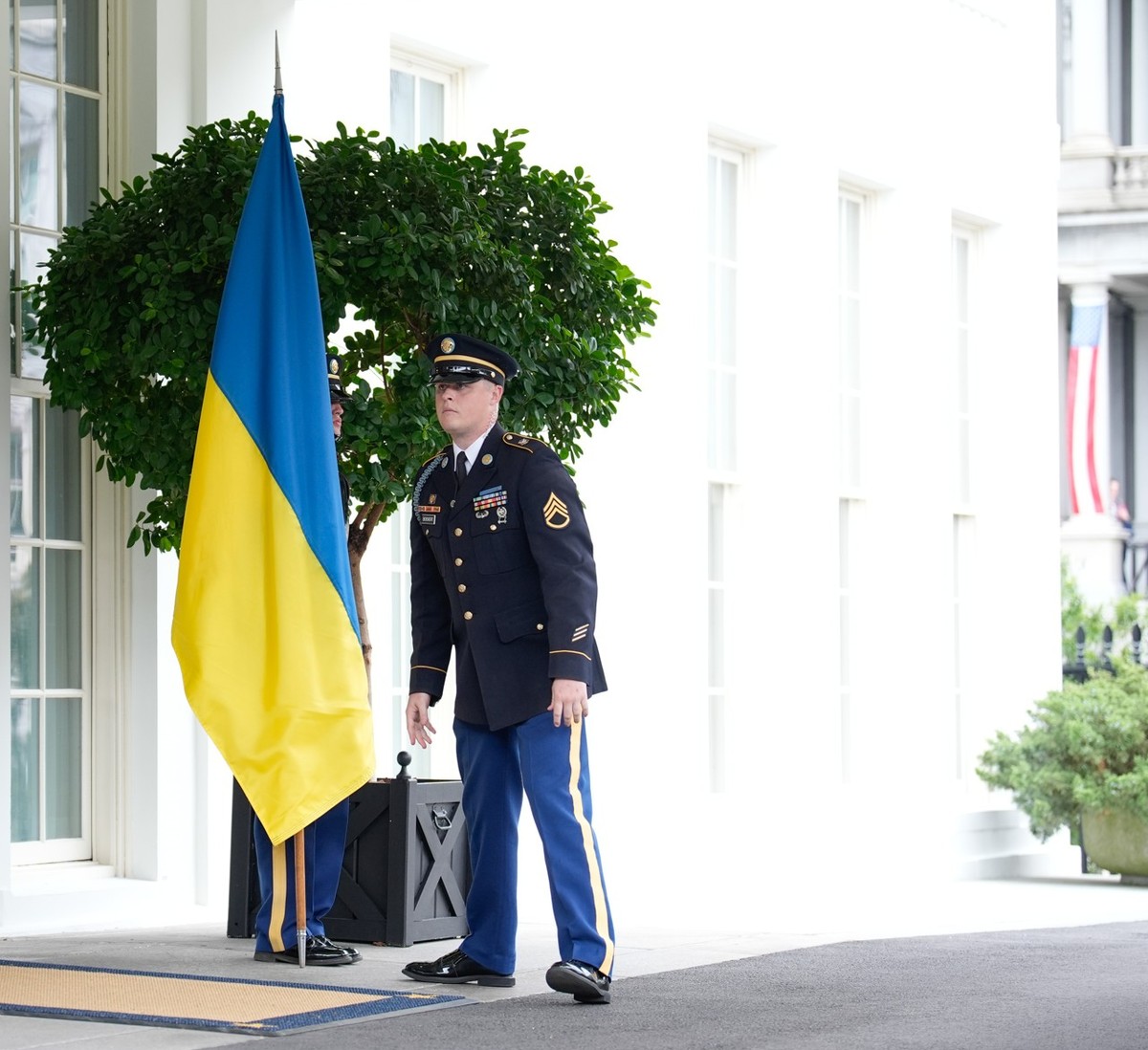 Guardsmen place the Ukrainian flag and the American flag at the entrance to the White House before the arrival of Ukrainian President Volodymyr Zelenskiy before a meeting with U.S. President Donald Tr ...