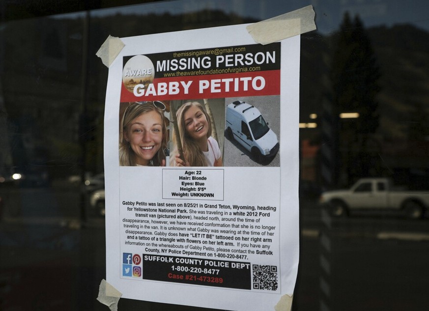 This Thursday, Sept. 16, 2021, photo, shows a Suffolk County Police Department missing person poster for Gabby Petito posted in Jakson, Wyo. Petito, 22, vanished while on a cross-country trip in a con ...