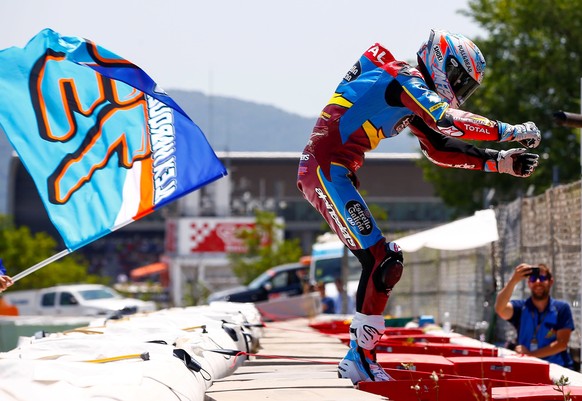 epa07651777 Spanish Moto2 rider of Estrella Galicia 0&#039;0 Kalex Alex Marquez celebrates winning the Motorcycling Grand Prix of Catalunya at the Circuit de Barcelona-Catalunya in Montmelo, near Barc ...