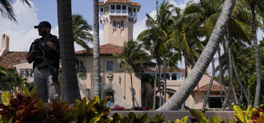 A security guard stands at the edge of former President Donald Trump's Mar-a-Lago home Monday, April 3, 2023, in Palm Beach, Florida, a day before he travels to New York for his arraignment on…