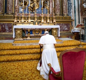 In this photo provided by the Vatican newspaper L'Osservatore Romano, Pope Francis kneels in prayer in front of the icon of the Virgin Mary inside St. Mary Major Basilica, in Rome, Thursday, March 14, 2013. Pope Francis opened his first morning as pontiff by praying Thursday at Rome's main basilica dedicated to the Virgin Mary, a day after cardinals elected him the first pope from the Americas in a bid to revive a Catholic Church in crisis and give it a preacher with a humble touch. (AP Photo/L'Osservatore Romano, ho)