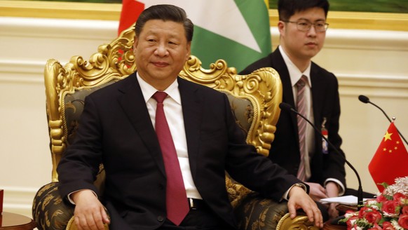 epa08135664 Chinese President Xi Jinping (L) attends the meeting with Myanmar State Counselor Aung San Suu Kyi (not in picture) during their meeting at president house in Naypyitaw Myanmar, 17 January ...