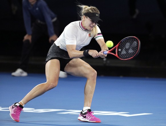 Canada&#039;s Eugenie Bouchard hits a backhand return to United States&#039; Serena Williams during their second round match at the Australian Open tennis championships in Melbourne, Australia, Thursd ...