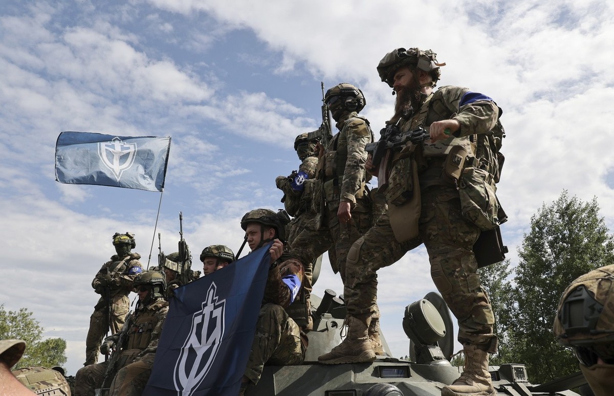 epa10650557 Members of the 'Russian Volunteer Corps' and 'Freedom of Russia Legion' hold a meeting with the media not far from the Ukraine-Russia border in Kharkiv's area, nor ...