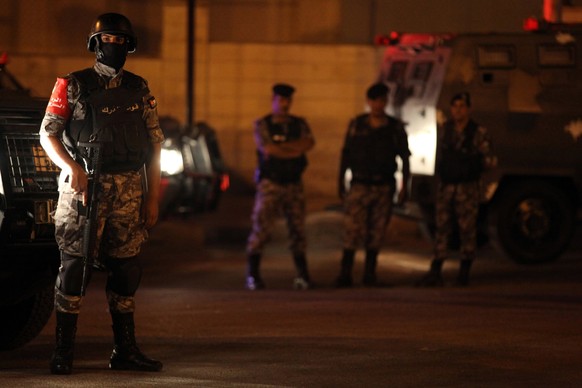 epa06105860 Jordanian security forces near the Israel embassy, in Amman, Jordan, 23 July 2017. Media reports state that one person is dead and one injured following an attack on the Isaeli embassy in  ...