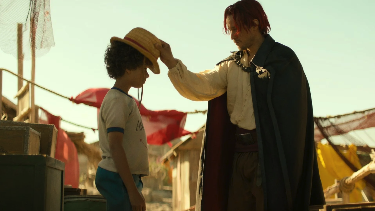 Luffy enfant, recevant son chapeau de son mentor Shanks Le Roux, une scène culte du manga.