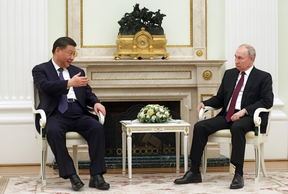 Chinese President Xi Jinping gestures as he speaks with Russian President Vladimir Putin during their meeting at the Kremlin in Moscow, Russia, Monday, March 20, 2023. (Sergei Karpukhin, Sputnik, Kremli…