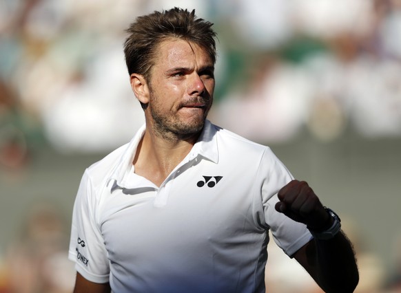 epa06858931 Stan Wawrinka of Switzerland celebrates a winner against Grigor Dimitrov of Bulgaria in their first round match during the Wimbledon Championships at the All England Lawn Tennis Club, in L ...