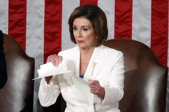 FILE - Speaker of the House Nancy Pelosi of California tears up her copy of President Donald Trump's State of the Union address after he delivered it at a joint session of Congress on Capitol Hill in Washington, F…